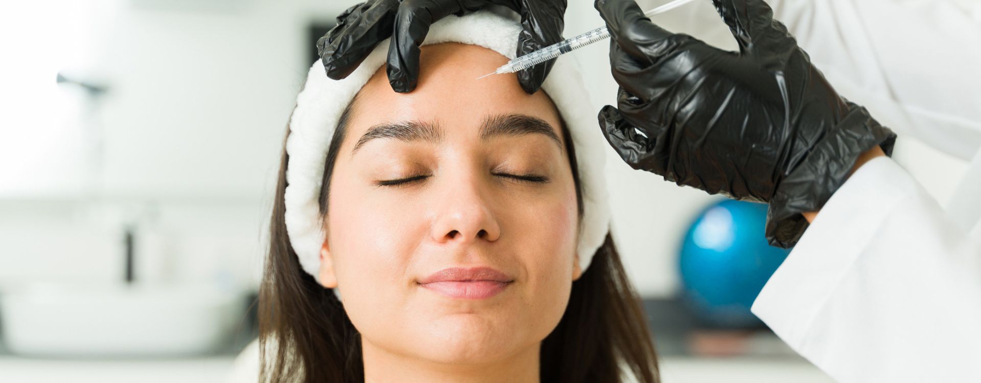 Woman getting forehead wrinkle treatment