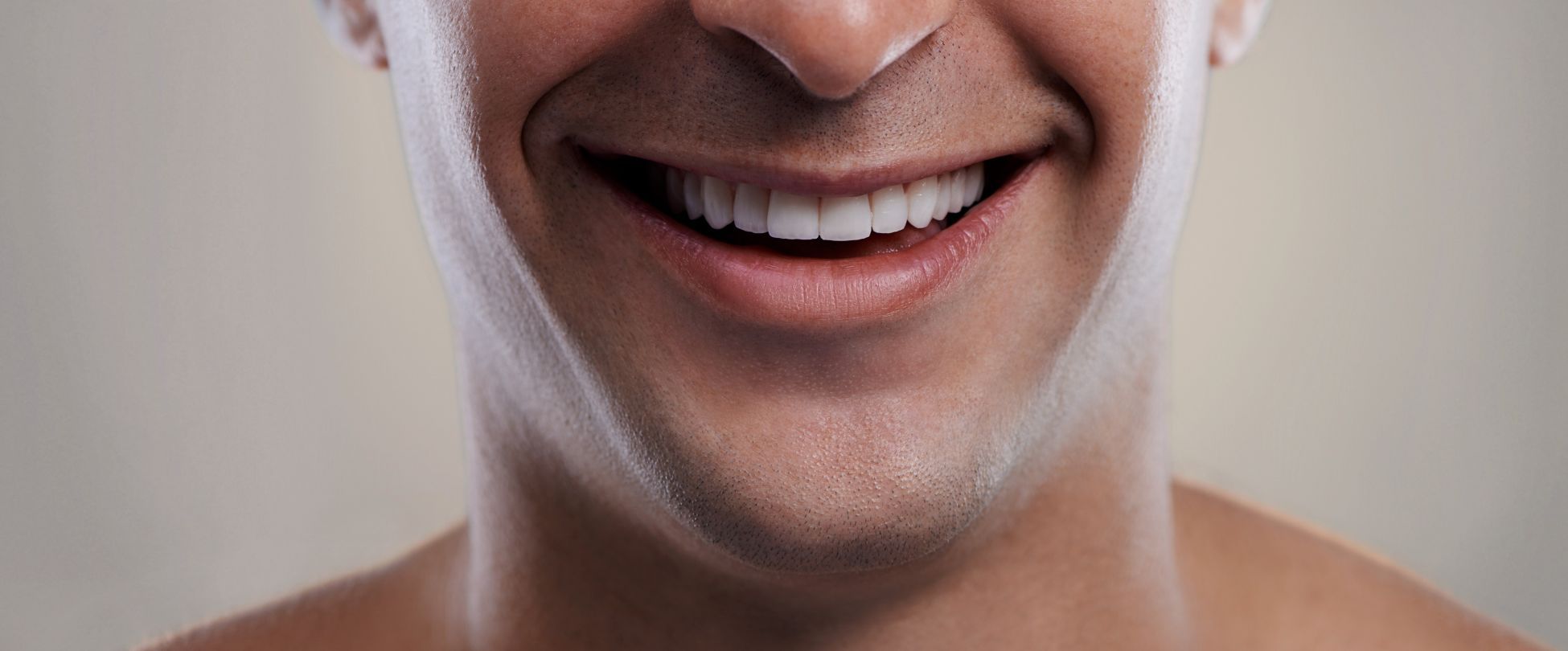 man with wide jaw smiling